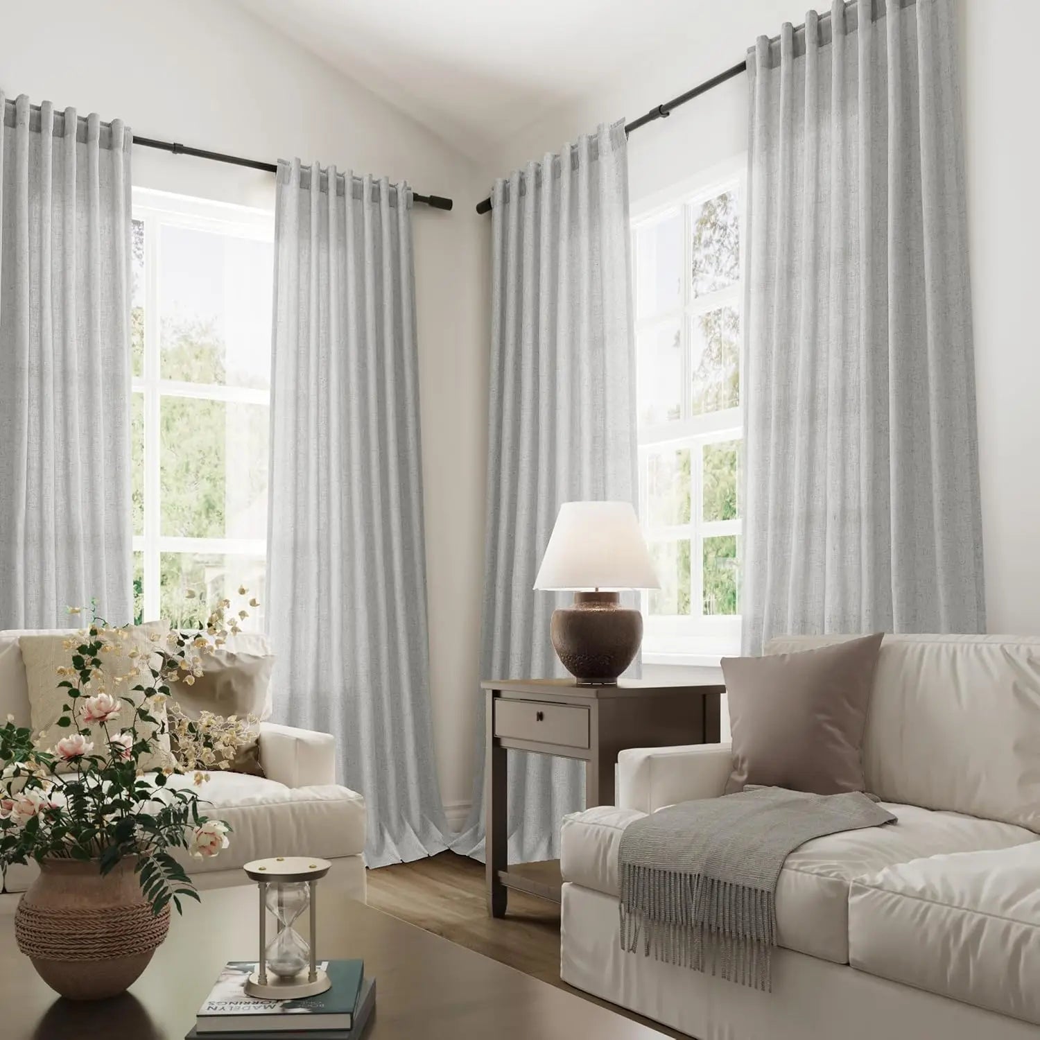 Light grey tall sheer curtains in a soft-toned lounge