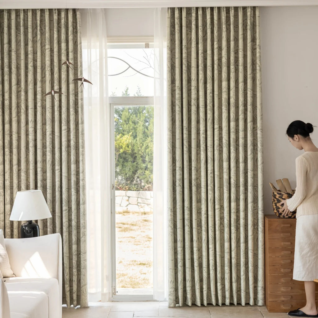 Full-height sage blackout curtains with sheer layer