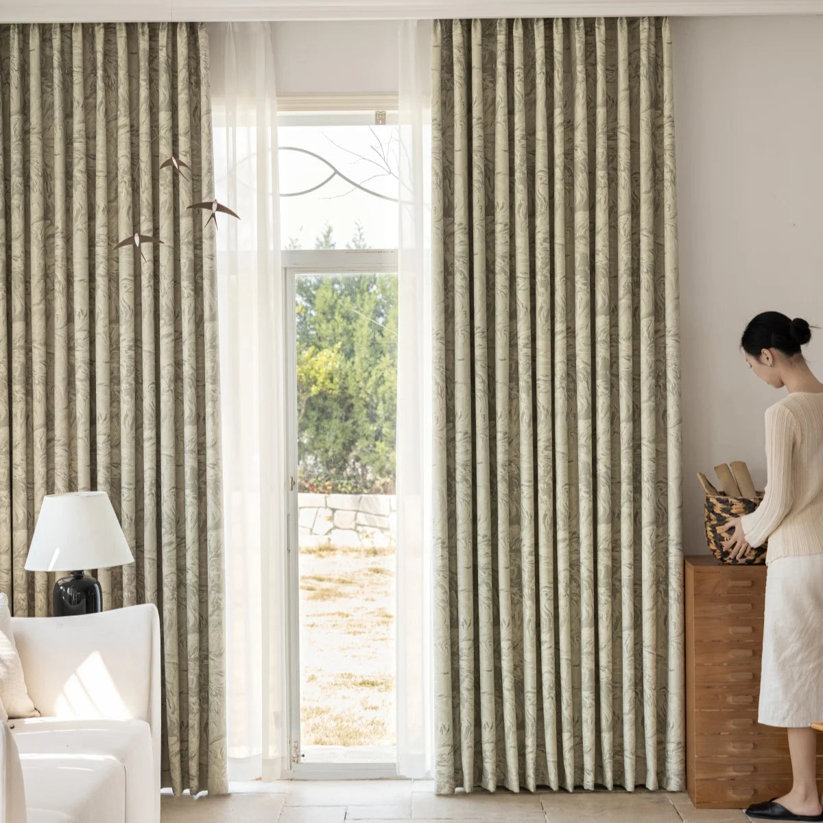 Full-height sage blackout curtains with sheer layer