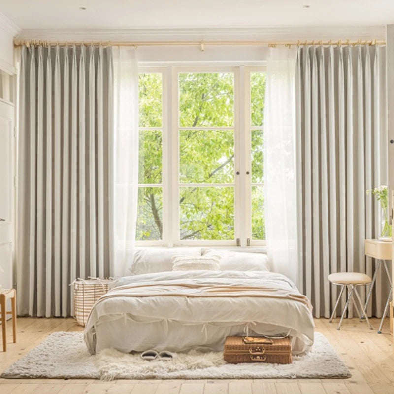 Greige herringbone curtains with sheer layer in a calm bedroom
