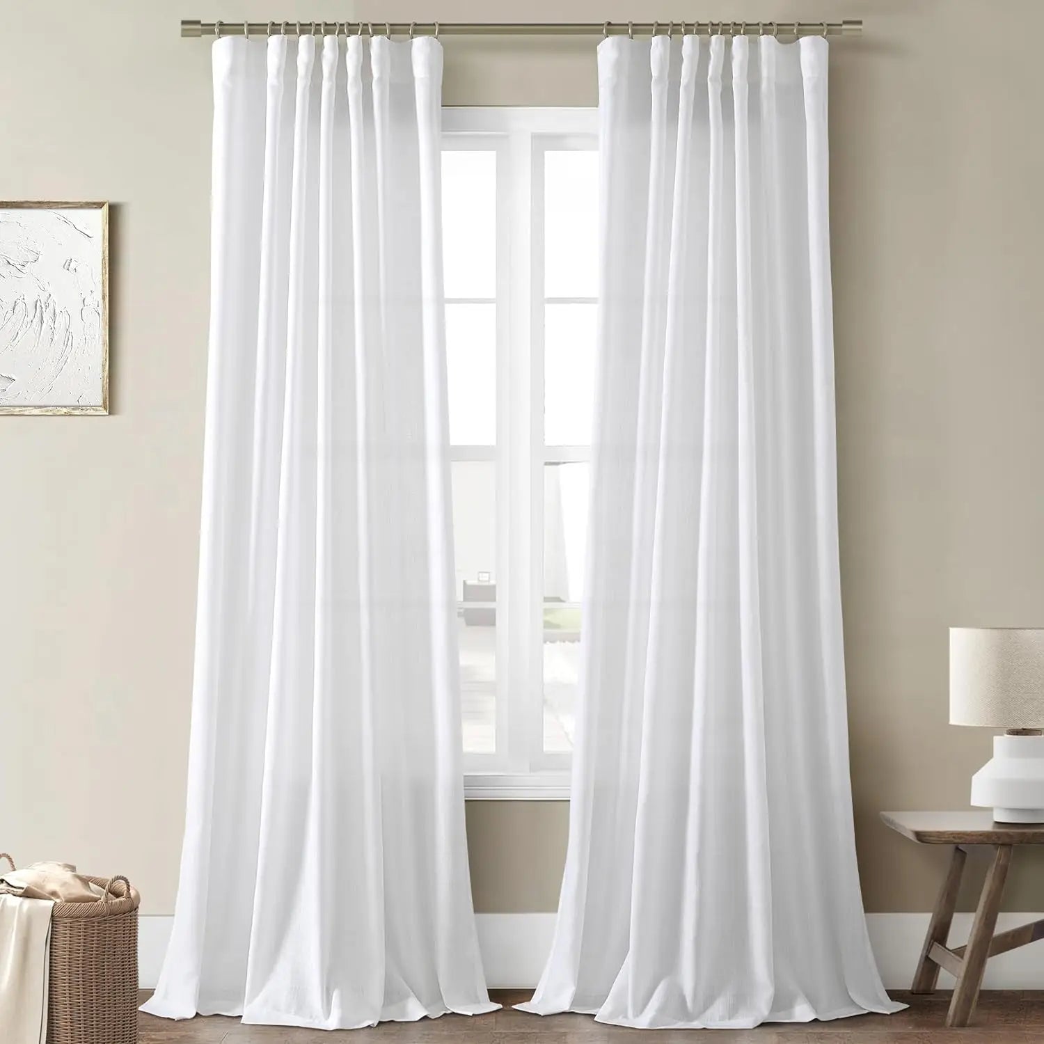 White sheer curtains on rings, full drop to the floor
