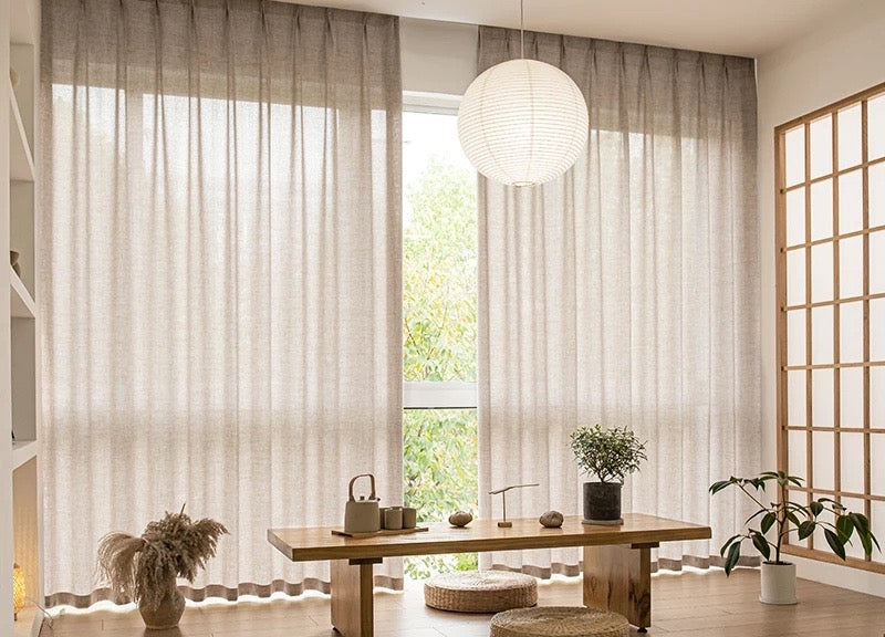Semi-sheer oatmeal voile curtains across a bright tatami room